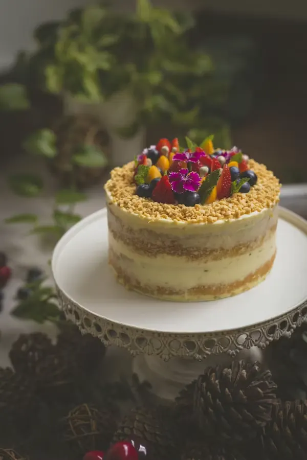 Naked-style corporate farewell cake topped with fresh berries and edible flowers