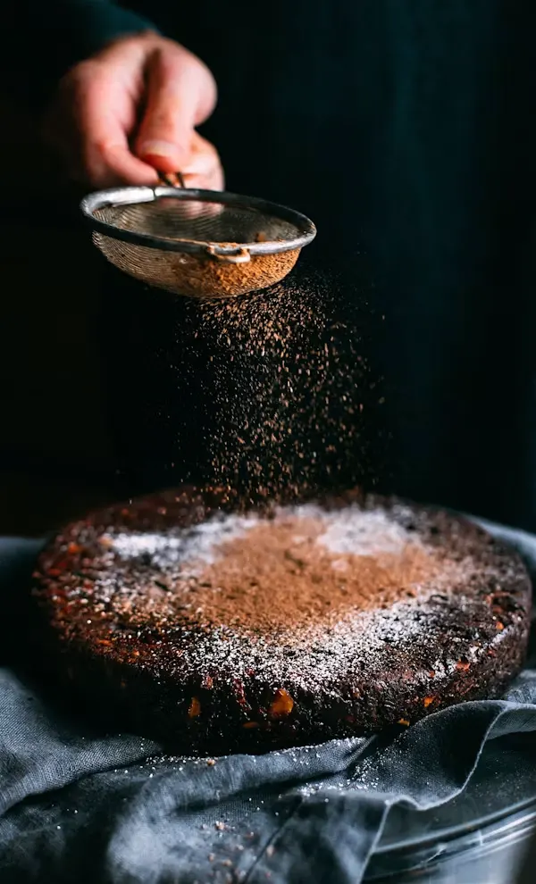 Cocoa dusting on a chocolate cake — The Pastry Man